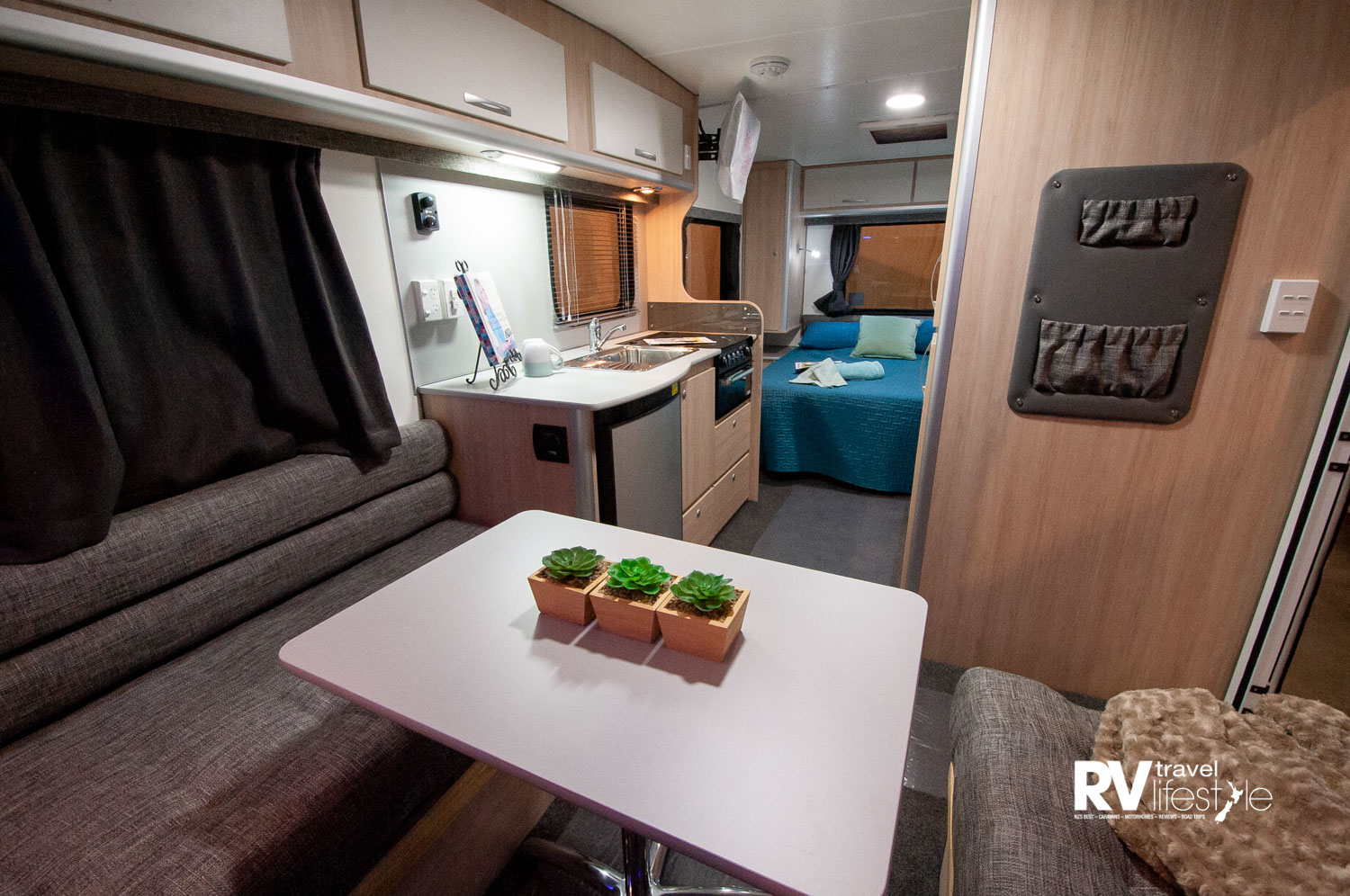 The lounge area can be made up into a large second bed. Heating vents are well placed, quality foam squabs and fabrics make for a comfortable seating area, colours can be chosen by clients to personalise your caravan